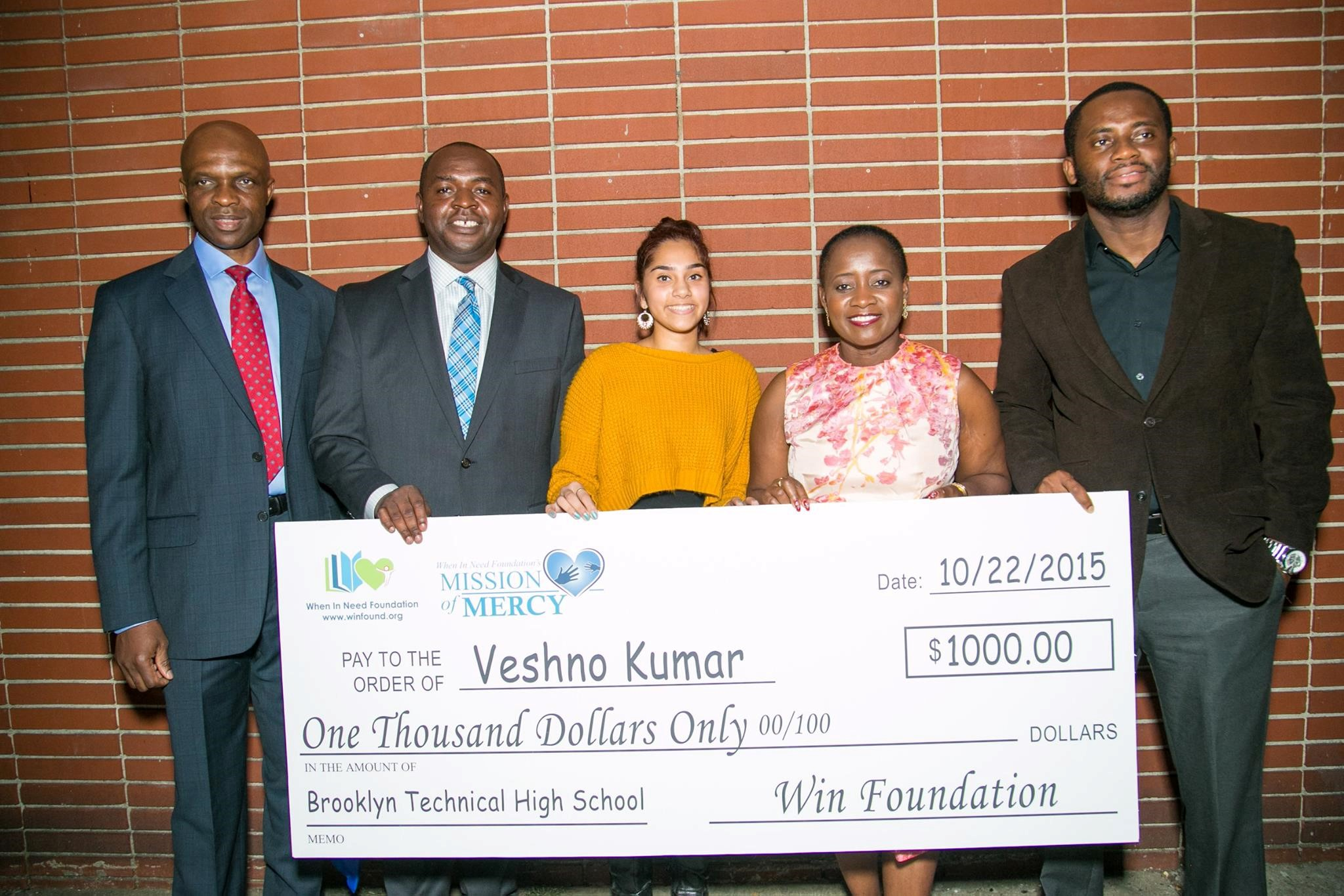 Veshno Kumar Accepts Scholarship Check